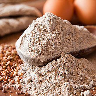 Spoon with flour mix and grains