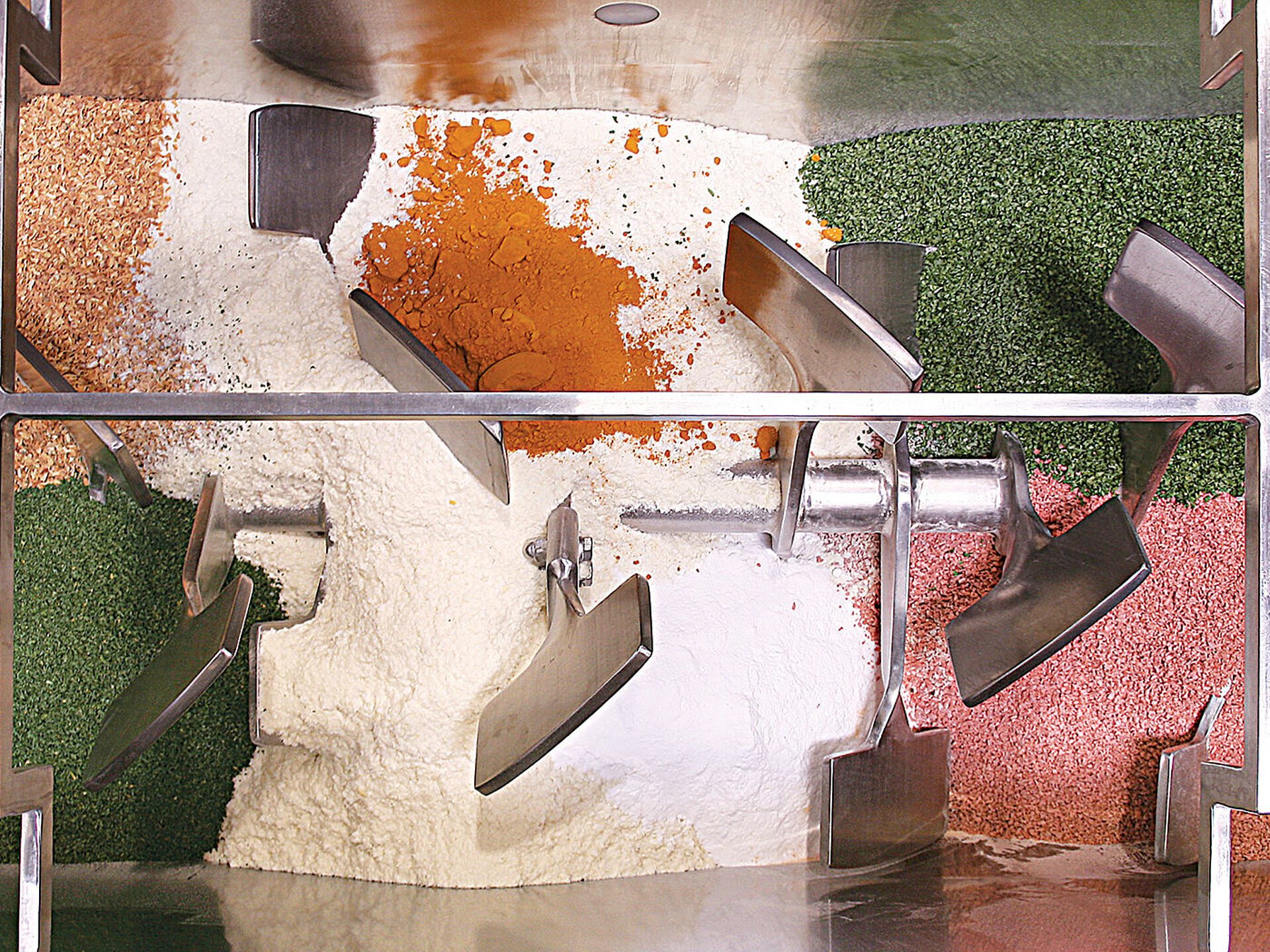 Spices to be blended in a fluidizing paddle blender from America Process Systems
