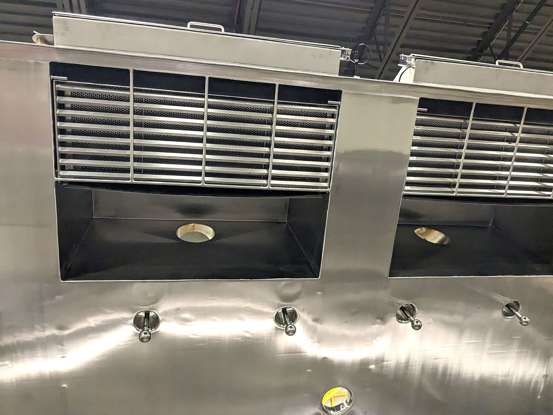 Non-filtered bad dump stations from below and clean-in-place spray balls.